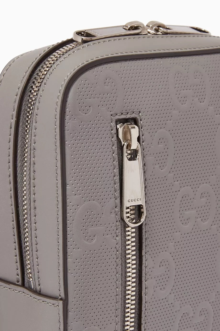 GUCCI GG EMBOSSED LEATHER SLINGBAG